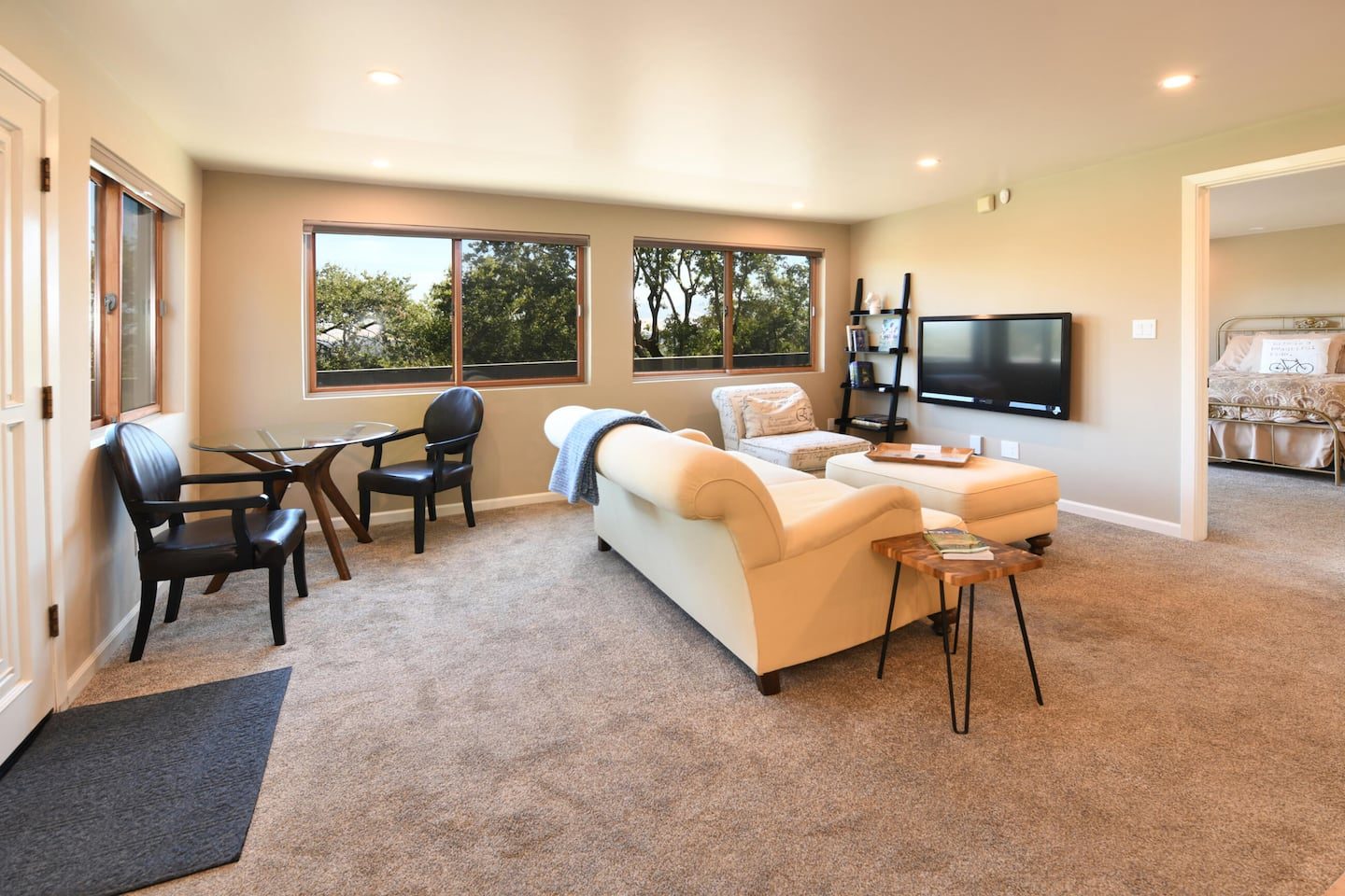 Bright living room with tree views